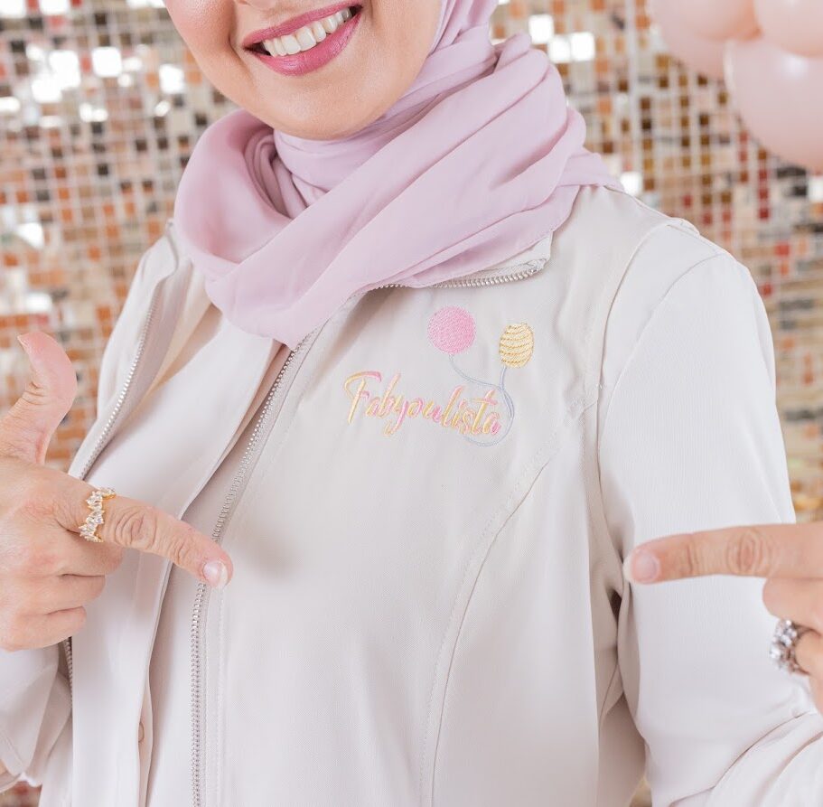 Close-up of Fabyoulista team member wearing branded vest with embroidered logo, showcasing professional balloon artistry and event décor services in Warner Robins, GA.
